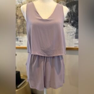 Boutique romper, size SMALL, lilac color, button closure.